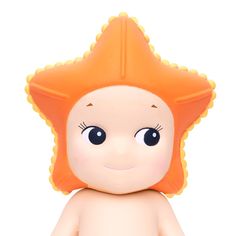 a toy doll with an orange hair and blue eyes is posed on a white background