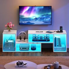 the entertainment center is lit up with blue lights and features headphones on each side