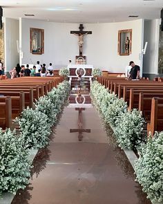 an empty church filled with pews and flowers