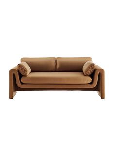 a brown leather couch with two pillows on the back and one arm folded over it