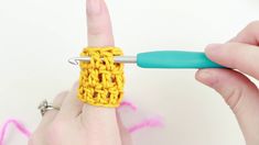 someone is crocheting the end of a piece of yarn