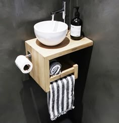 a bathroom sink with a wooden cabinet underneath it and a white bowl on the counter