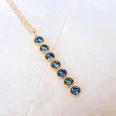 14K Gold Hues of Blue Sapphire Necklace Dainty Sapphire Necklace, Blue Round Pendant Necklace With Bezel Setting, Blue Pendant Necklace With Bezel Setting, Blue Necklace With Bezel-set Round Pendant, Sapphire Necklace Simple, Eco Friendly Necklace, Montana Sapphires, Jewelry Product Shots, Hues Of Blue