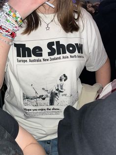 a woman wearing a t - shirt with the show on it