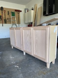 the unfinished cabinets are ready to be built into the wall and put together in the garage