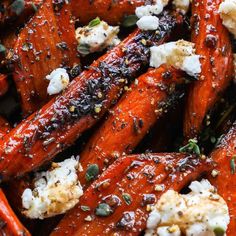 roasted carrots with feta cheese and herbs on top, ready to be eaten