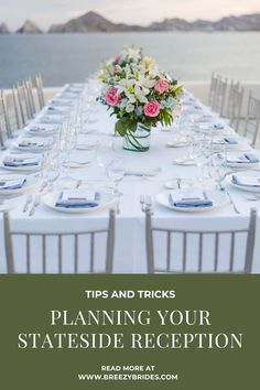 a long table set up with flowers and place settings