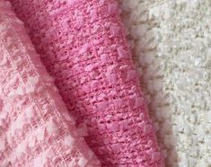 a close up view of a pink lace fabric