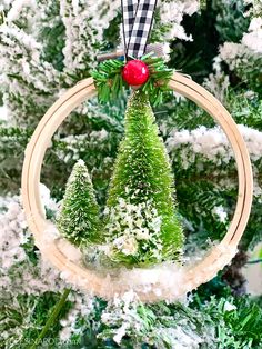 a christmas tree ornament hanging from a hoop