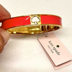 New With Tag! Pretty Coral Colored Enamel Over Gold Tone Metal Setting Bangle Opens By Pressing The Tab On The Side Cut Out Signature Spade Bow Bracelet, Enamel Bangle, Ball Bracelet, Spade Jewelry, Kate Spade Jewelry, Hinged Bangle, Gold Enamel, Coral Color, Gold Bangles