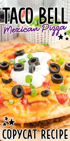 the mexican pizza is topped with black olives and sour cream