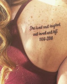 a woman with a tattoo on her back saying she lived and taught, and loved and left