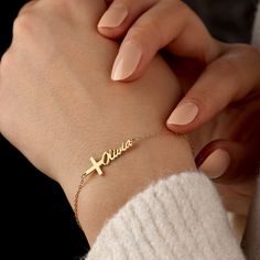 Introducing our beautiful Cross Name Bracelet, a unique and personalized piece of jewelry that combines faith and individuality. This bracelet features a delicate cross charm, symbolizing love, hope, and spiritual connection. The charm is accompanied by a customizable nameplate, where you can engrave the name of your choice. Crafted with care, this bracelet showcases a dainty design that is both elegant and meaningful. Made from high-quality materials, it ensures durability and lasting beauty. W Spiritual Engraved Name Bracelet Gift, Spiritual Engraved Name Bracelet For Gift, Elegant Personalized Cross Bracelets, Personalized Gold Rosary Bracelet For Birthday, Custom Name Cross Jewelry For Gift, Personalized Rosary Bracelet For Birthday, Elegant Personalized Rosary Bracelet As Gift, Customizable Cross-shaped Jewelry For Gifts, Customizable Spiritual Name Bracelet As Personalized Gift