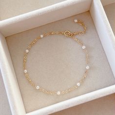 * DETAILS* This dainty bracelet is a perfect gift to the one you love or to yourself. A nice every day bracelet. - Swarovski Crystal Pearl Beads 3mm - 24k Gold Filled Chain - 14K GOLD FILLED Wire - 14k Gold Filled Spring Ring Clasp ✨ All components are 14k Gold Filled. 👉🏻For more pearl bracelets, see https://www.etsy.com/shop/JinnysJewelryBySeJin 🌟You may also like Blue Topaz Bracelet. Here is the link. https://www.etsy.com/JinnysJewelryBySeJin/listing/1088450006/london-blue-topaz-14k-gold-fi Affordable Round Pearl Bracelet For Birthday, Crystal Pearl Bracelet, Gold Bracelet With Pearls, Minimalist Pearl Bangle Bracelet Gift, Dainty Delicate Chain Bracelet For Gifts, Dainty Delicate Chain Bracelet As Gift, Dainty Hypoallergenic Beaded Bracelets As Gift, Delicate Hypoallergenic Beaded Bracelets As Gift, Dainty Hypoallergenic Beaded Bracelets For Gifts