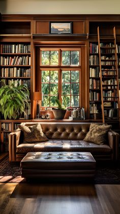 a living room with bookshelves, leather couch and coffee table in front of a window