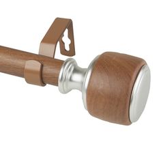 a wooden door handle with a metal ring on it