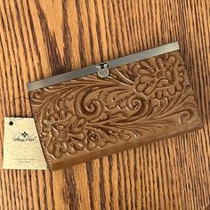 Patricia Nash Cauchy Tooled Leather Wallet In Biscuit Gorgeous And Elegant Wallet Crafted In Floral Embossed Leather With Handcrafted Stitching - It's Stunning! Unique Push Lock Closure, With Brushed Metal Hardware Interior Has Zip Pocket, 3 Slip Pockets And 10 Card Slots Rfid Protected Approx. 7-1/2" W X 4" H X 1" D Brand New, With Tags! Protective Plastic On Frame. Cognac Leather Wallet, Biscuit Color, Tooled Leather Wallet, Elegant Wallet, Wallet Craft, Tooled Leather, Brushed Metal, Metal Hardware, Leather Tooling