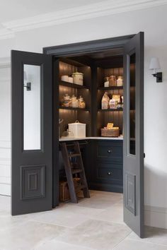 an open door leading into a kitchen with shelves