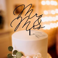 a wedding cake with the word mr and mrs on it