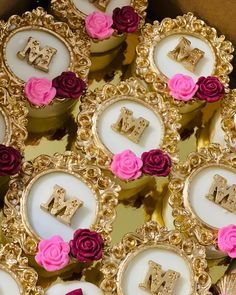 some cupcakes are decorated with pink and red flowers