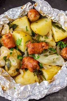 the food is prepared and ready to be eaten in the foil wrapper on the table