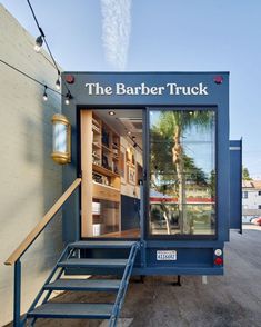 the barber truck has stairs leading up to it