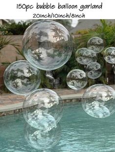 some clear bubbles floating in the air near a pool