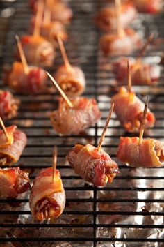 bacon wrapped in toothpicks on top of a bbq grill with the caption's facebook page below