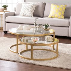 a living room scene with focus on the coffee table and the couch in the background