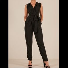 Fits More Like A Size 6ish Chic Black Belted Jumpsuits And Rompers, Chic Black Jumpsuit With Tie Waist, Formal Black Belted Jumpsuit, Fitted Black Jumpsuits And Rompers With Tie Waist, Black Belted Jumpsuit For Date Night, Black Fitted Jumpsuit With Tie Waist, Chic Black Jumpsuits And Rompers For Work, Chic Black Jumpsuits For Work, Black Tie Waist Jumpsuit For Work