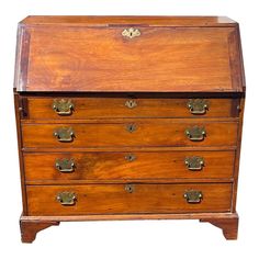 an old wooden chest with brass hardware on the top and bottom drawers, against a white background