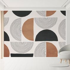 an abstract wallpaper design with black, brown and white circles on the wall next to a chair