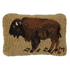 a brown and black bison hooked up to a door mat on a white background,