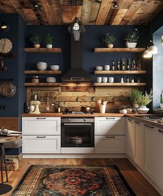 a kitchen with blue walls and wooden shelves