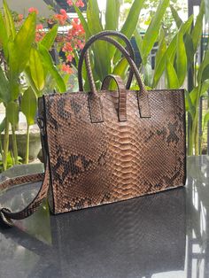 Snakeskin Shopper Bag Outside: premium quality DRAGON python leather Inside: leather Accessories: silver All our products are 100% handmade, we always try to create interesting ideas to make your style unique. We use only the highest quality materials and accessories from around the world and only best leather from Indonesia. Before listing each new model undergoes different quality and usability tests at every stage of production. Every single piece is made by hand, by a highly-skilled speciali Brown Leather Tote Bag, Leather Shopper Bag, Large Leather Bag, Leather Waist Bag, Snake Skin Bag, Best Leather, Accessories Silver, Brown Leather Totes, Croc Leather