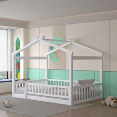 a child's bedroom with a white bed and green walls