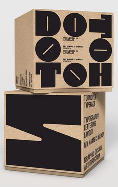 two cardboard boxes stacked on top of each other with the words do it in different languages