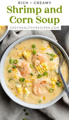 two bowls filled with shrimp and corn soup on top of a gray cloth next to a spoon