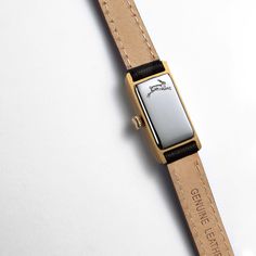 Kimsey Watch in Gold | Classic, small gold watch for women – March Hare Gold Minimalist Watch Accessories For Formal Occasions, Everyday Timeless Rectangular Watch Accessories, Timeless Rectangular Watch Accessories For Everyday, Timeless Rectangular Everyday Watch Accessories, Classic Evening Watch Accessories With Rectangular Dial, Timeless Evening Watch With Gold Clasp, Elegant Gold Rectangular Watch Accessories, Elegant Rectangular Watches As A Gift, Minimalist Formal Watch Accessories With Leather Strap