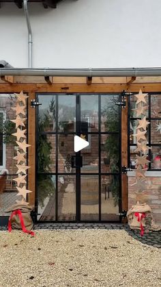 the entrance to a building with wooden stars on it