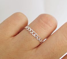 Bold and beautiful. This flexible diamond cut curb chain ring is handcrafted with high-quality sterling silver material and made to order just for you. Can be worn when washing hands or showering! Wear this chain ring alone or stack it with other rings for a layered looked! Great for gifting. Handmade in Los Angeles, CA! Packaging:  Comes in a gift box, ready for gift-giving! Dimensions: Width: 2.7mm  Thickness: 0.7mm Material: Sterling Silver / 925 Benefits of Sterling Silver / 925 Jewelry: 1. Silver Chain Ring, Chain Link Ring, Link Ring, Washing Hands, Ring Chain, Stack Ring, Linking Rings, Chain Silver, Silver Material