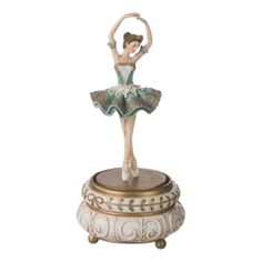 a figurine with a ballerina on it's head and arms in the air