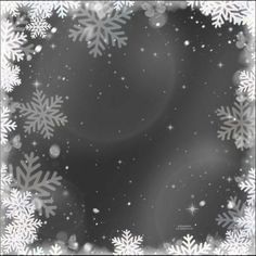 a black and white photo with snowflakes in the middle on a dark background