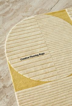 a yellow rug with the words creative flooring rugs on it