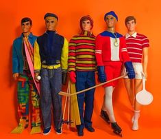 five action figures are posed in front of an orange background and one is holding a tennis racket