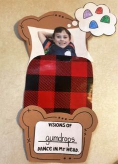 a piece of cardboard with a picture of a child in a bear costume on it