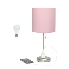 a pink lamp next to a remote control