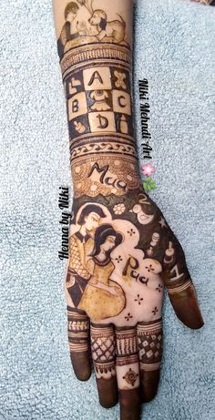 the hand is decorated with henna designs