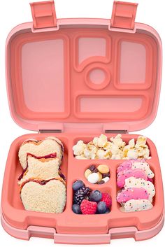 a pink lunch box filled with sandwiches and fruit