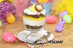 an easter trifle dessert in a glass dish with the title cadbury egg easter trifle